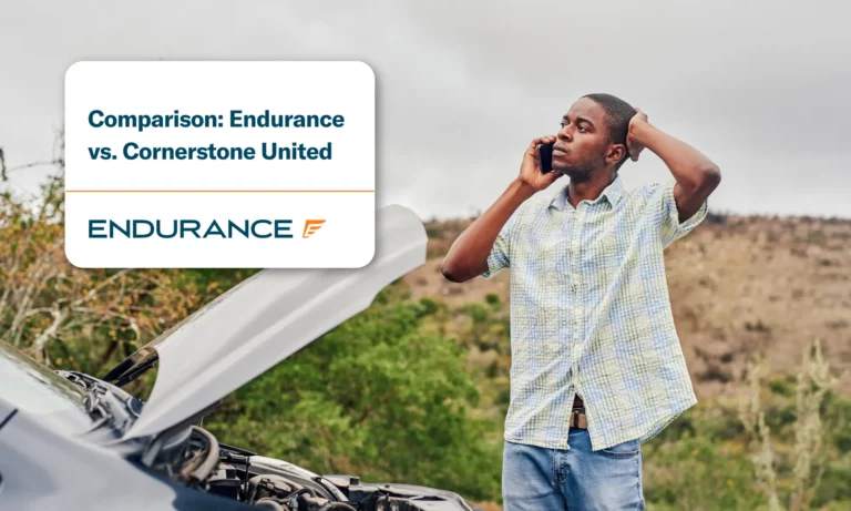 Young man calling roadside assistance while standing next to his broken down car