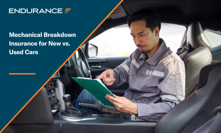 A mechanic with a clipboard sitting in a car