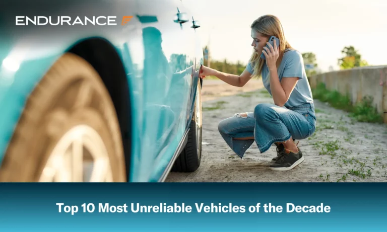 Young woman on the side of the road next to her car calling roadside assistance