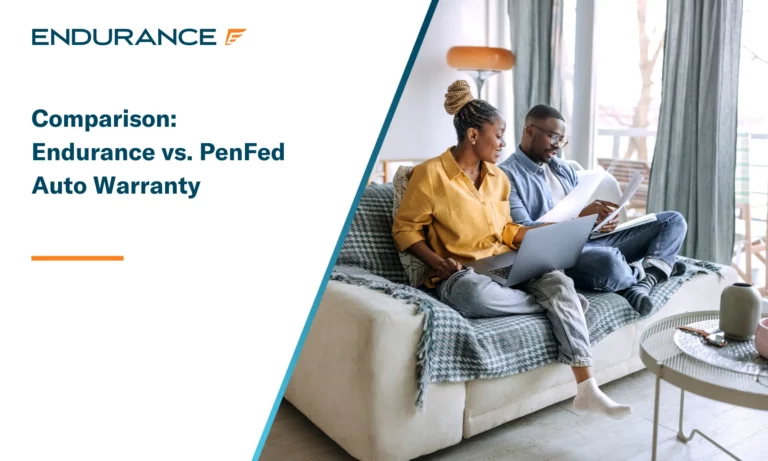 Young smiling couple on their couch going over paperwork